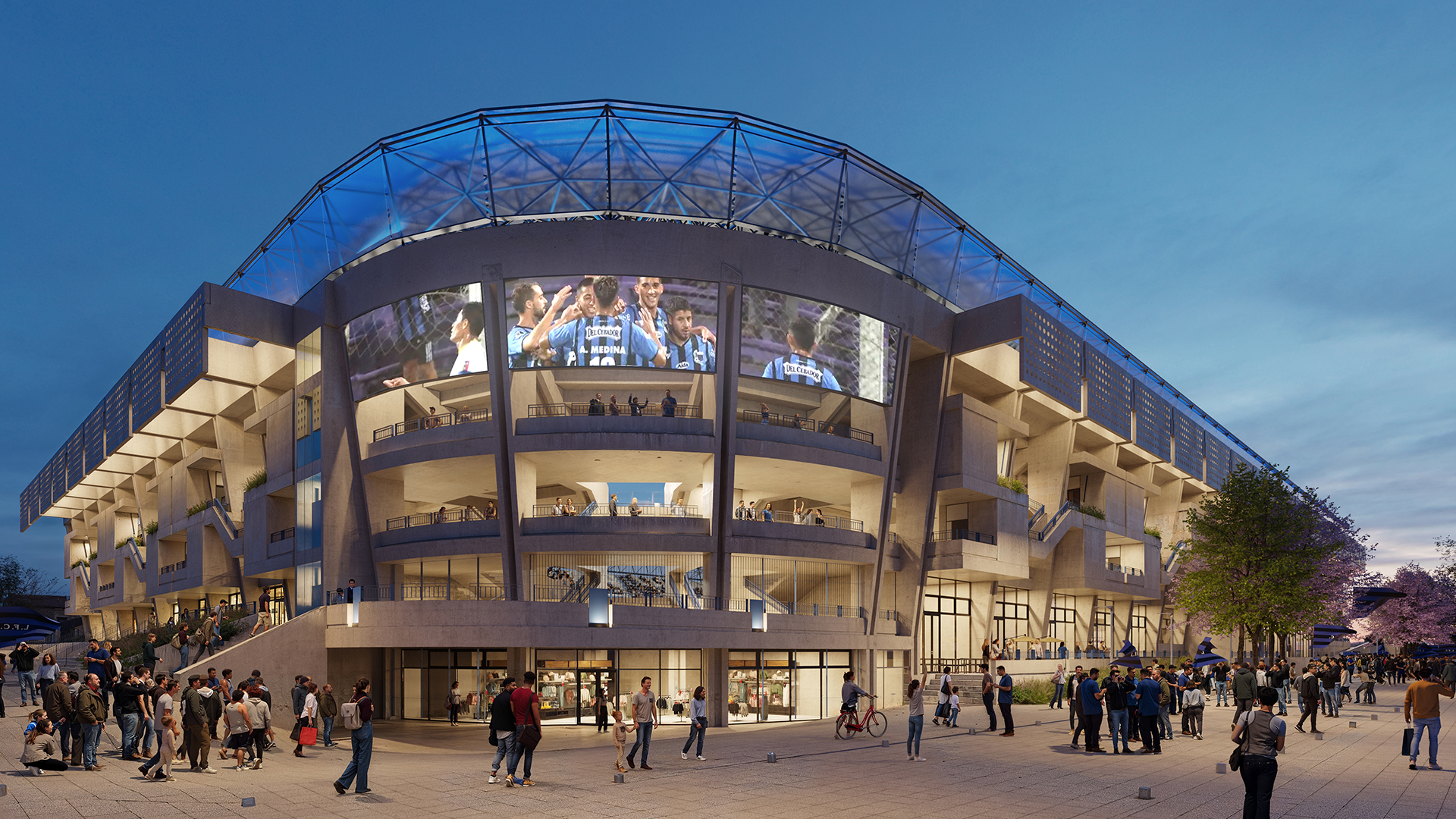 Plaza y fachada del estadio de día con jacarandás